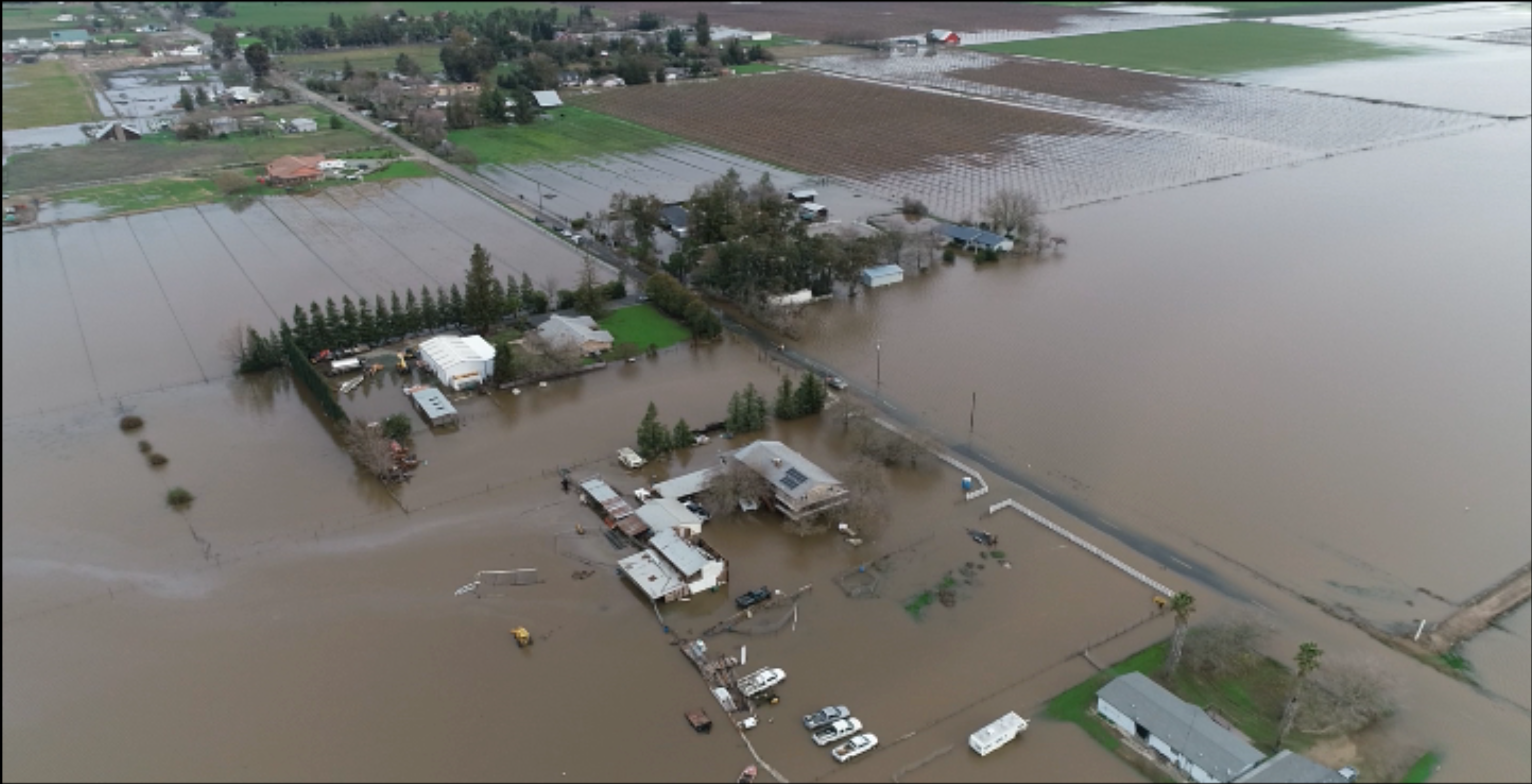 Homes surrounded by flood water